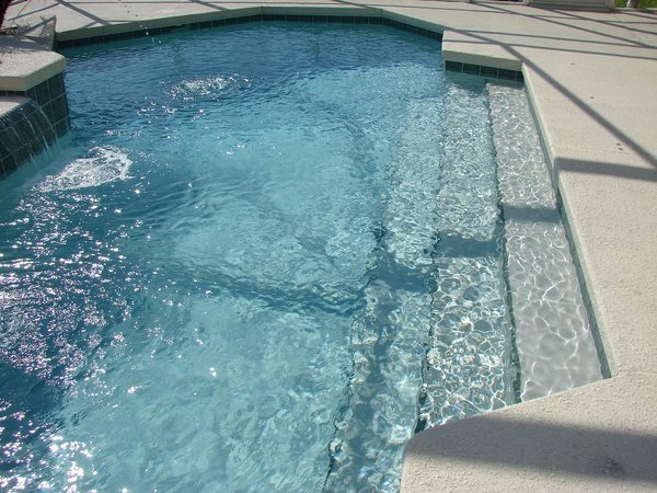 What are the best practices for ensuring pool safety during a UK home's construction phase?